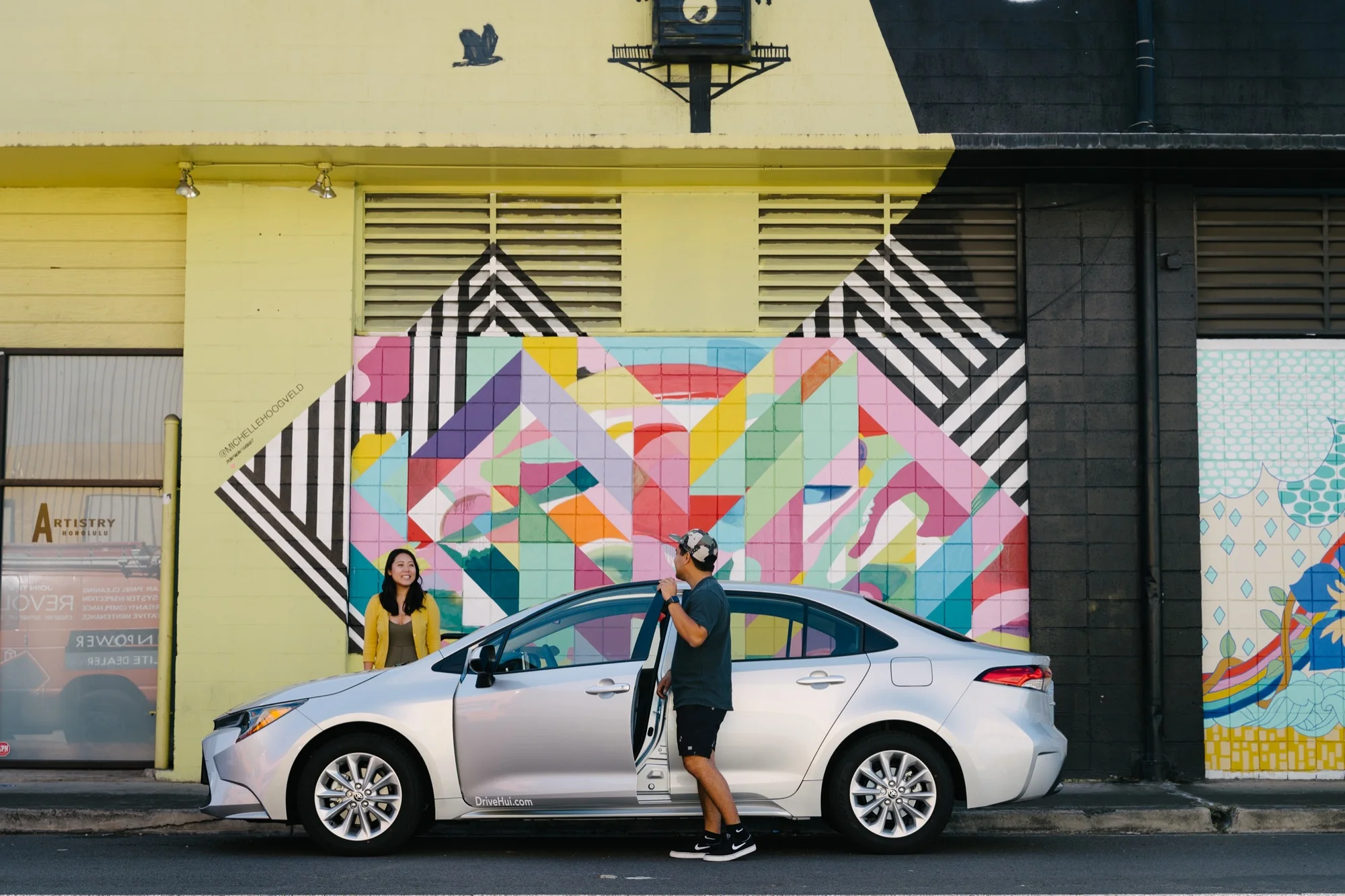 couple driving a Hui to a Valentine's Day date in Kakaako